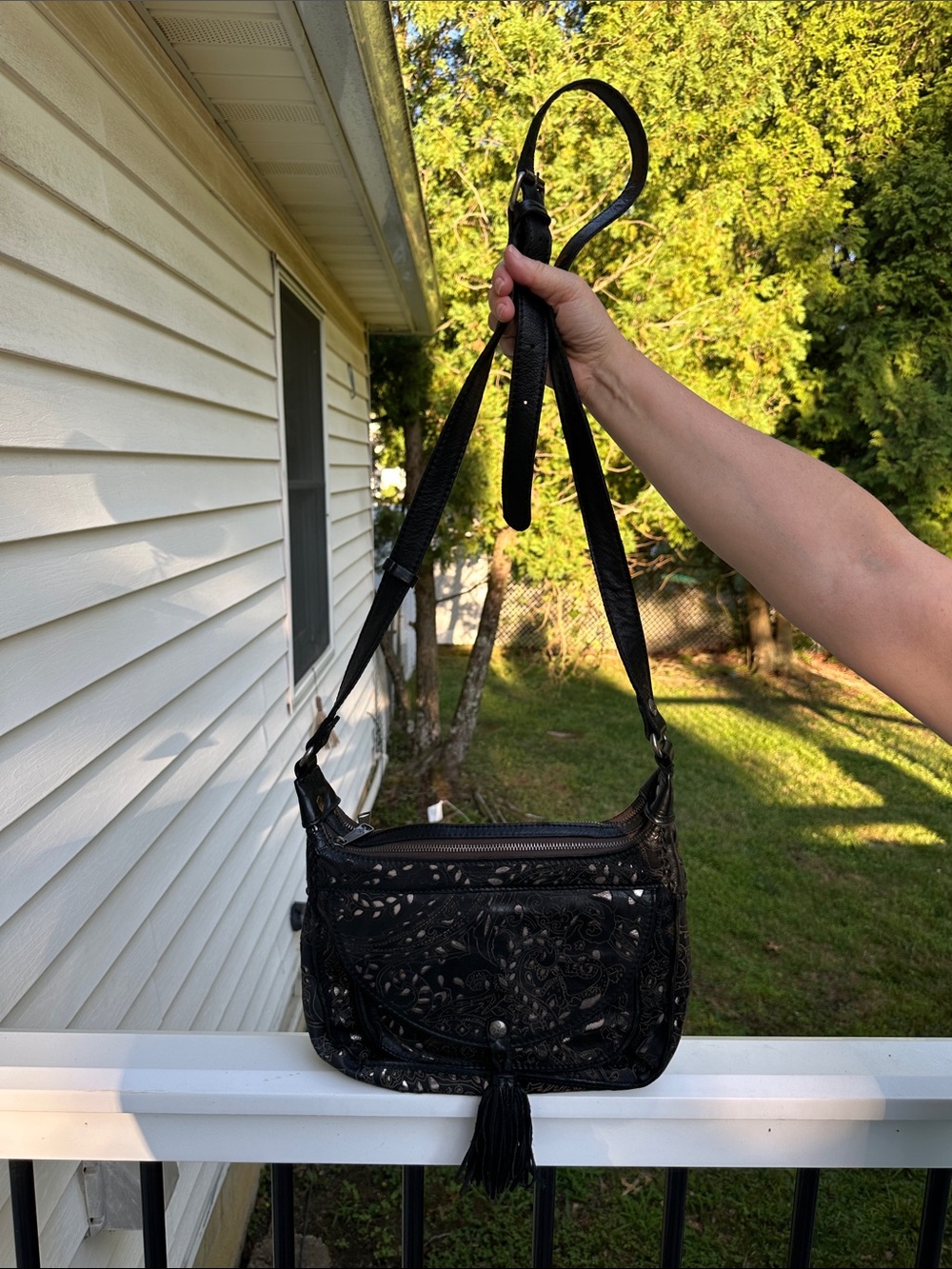 Patricia Nash Black Floral Cutout Crossbody with Tassel Accent